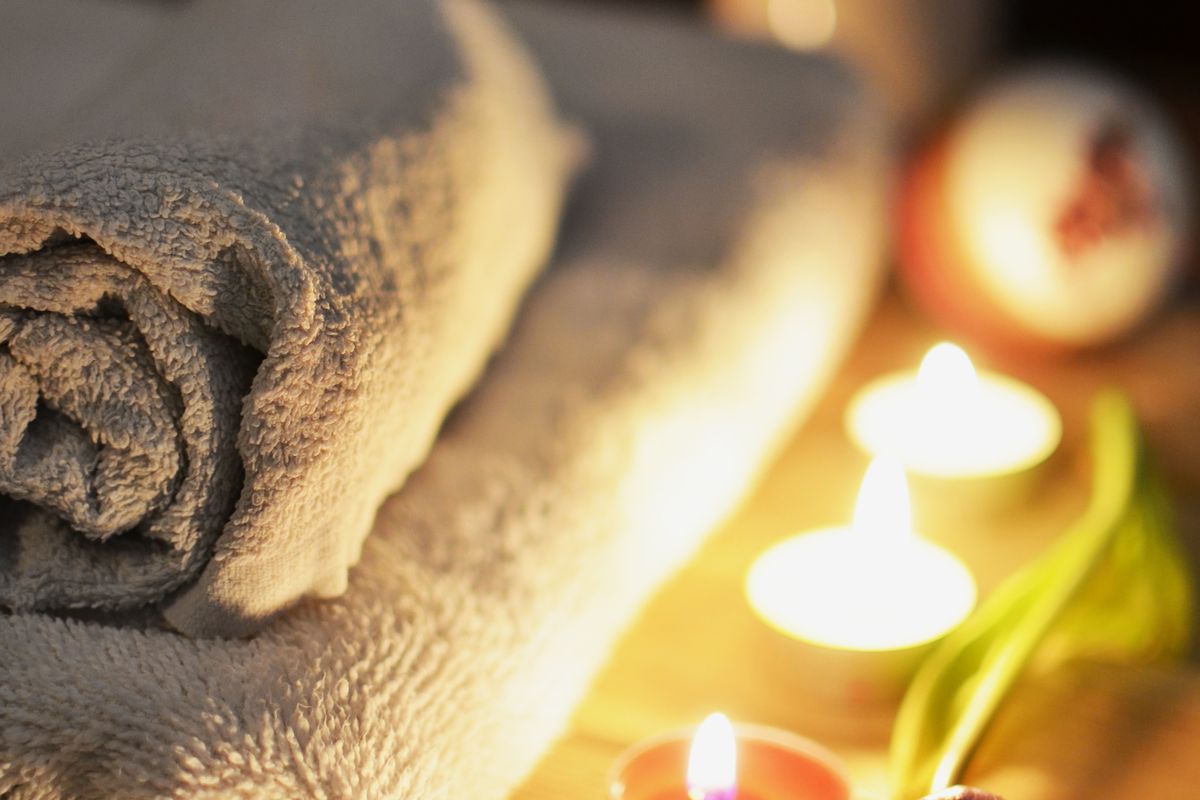Towels, candles and botanicals at the spa